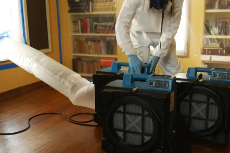 HEPA air filtration system and containment barriers during mould remediation
