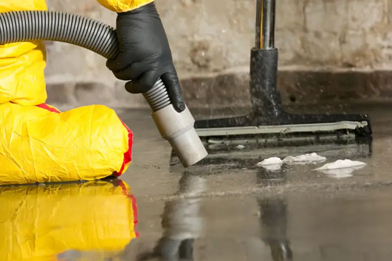 Specialists extracting contaminated water from a flooded area in a Melbourne property