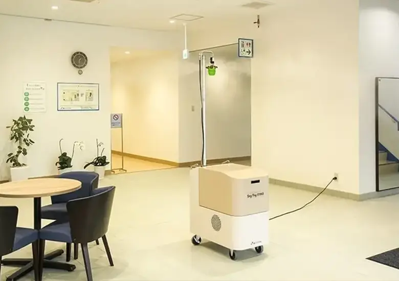 Technician performing deodorisation treatment to remove indoor odours and improve air quality.