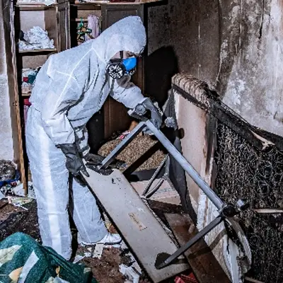 Cleanup team removing debris from a fire-damaged structure