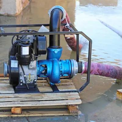 Powerful flood water extraction pump removing water from a Melbourne residential property