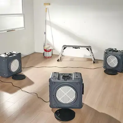 Specialist using odour control equipment after fire damage restoration