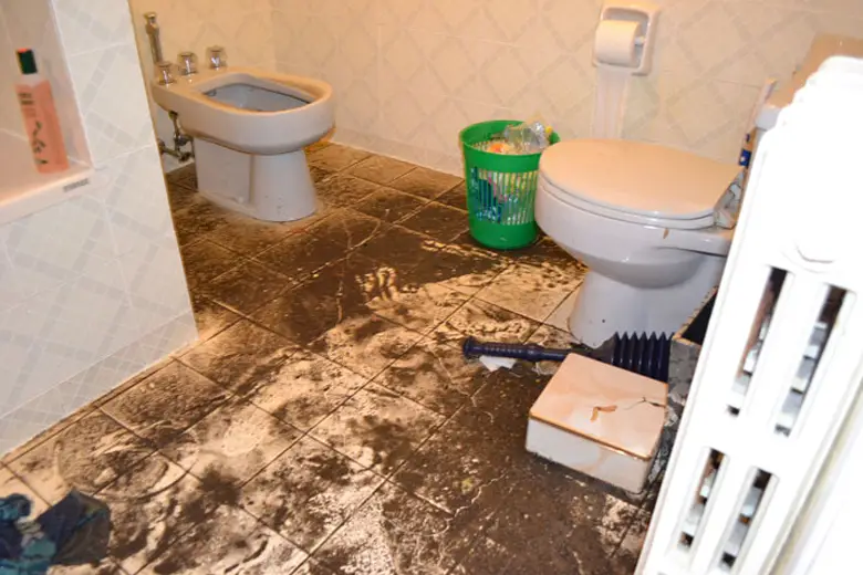 Inspector evaluating structural damage and safety risks at a water-damaged site in Victoria