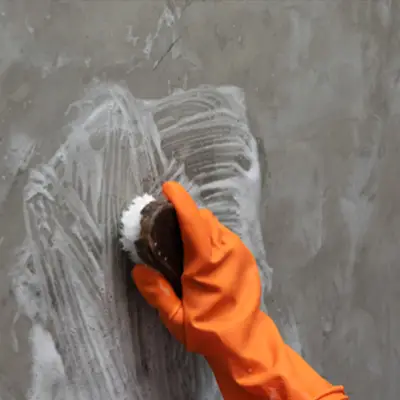 Technician performing soot removal on a fire-damaged surface in Melbourne