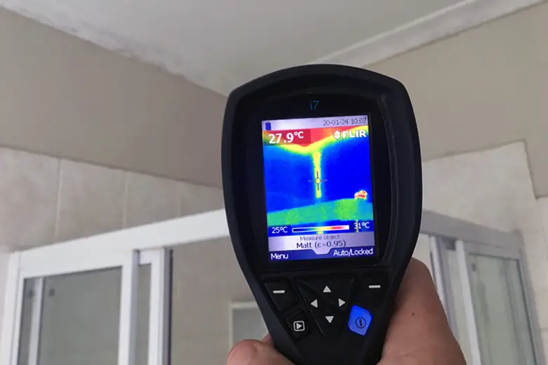 Technician using modern thermal imaging and acoustic equipment to detect water leaks in a Melbourne property