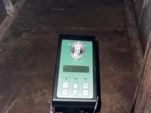 Air sampling being conducted in a damp attic roof space to test for mould and airborne contaminants in a Melbourne property.