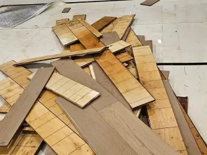 Removal and safe disposal of contaminated timber flooring from a water-damaged property in Melbourne by Victoria Hygiene.