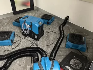 Industrial drying equipment operating in a water-damaged office space in Melbourne during professional restoration by Victoria Hygiene.