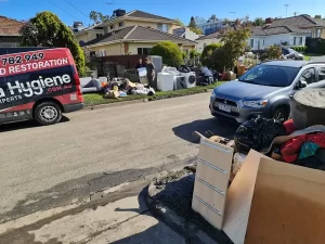 Contaminated materials being removed from a flood affected property during restoration in Melbourne.