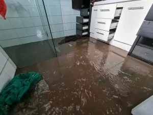 Bathroom flooded with grey water and sewage due to a sewer outburst in a Melbourne property.