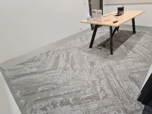 Mould growth visible on concrete floor surface after removal of wooden flooring in a Melbourne property.