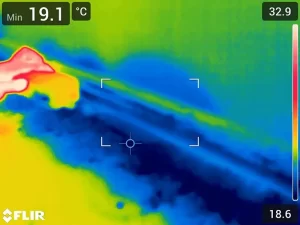 Thermal scan showing moisture spread on a wet kitchen counter caused by a burst pipe in a Melbourne home.