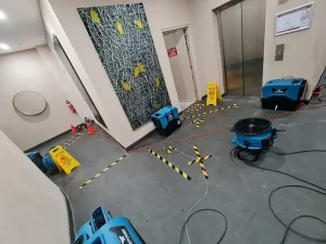 Water damage restoration equipment set up in the lobby of a high rise building in Melbourne following flooding.