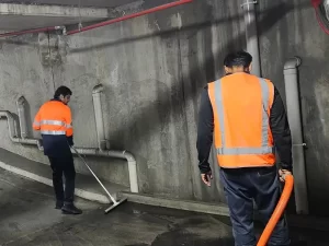 Water extraction equipment in use at a flooded underground car parking area in Melbourne during emergency restoration.